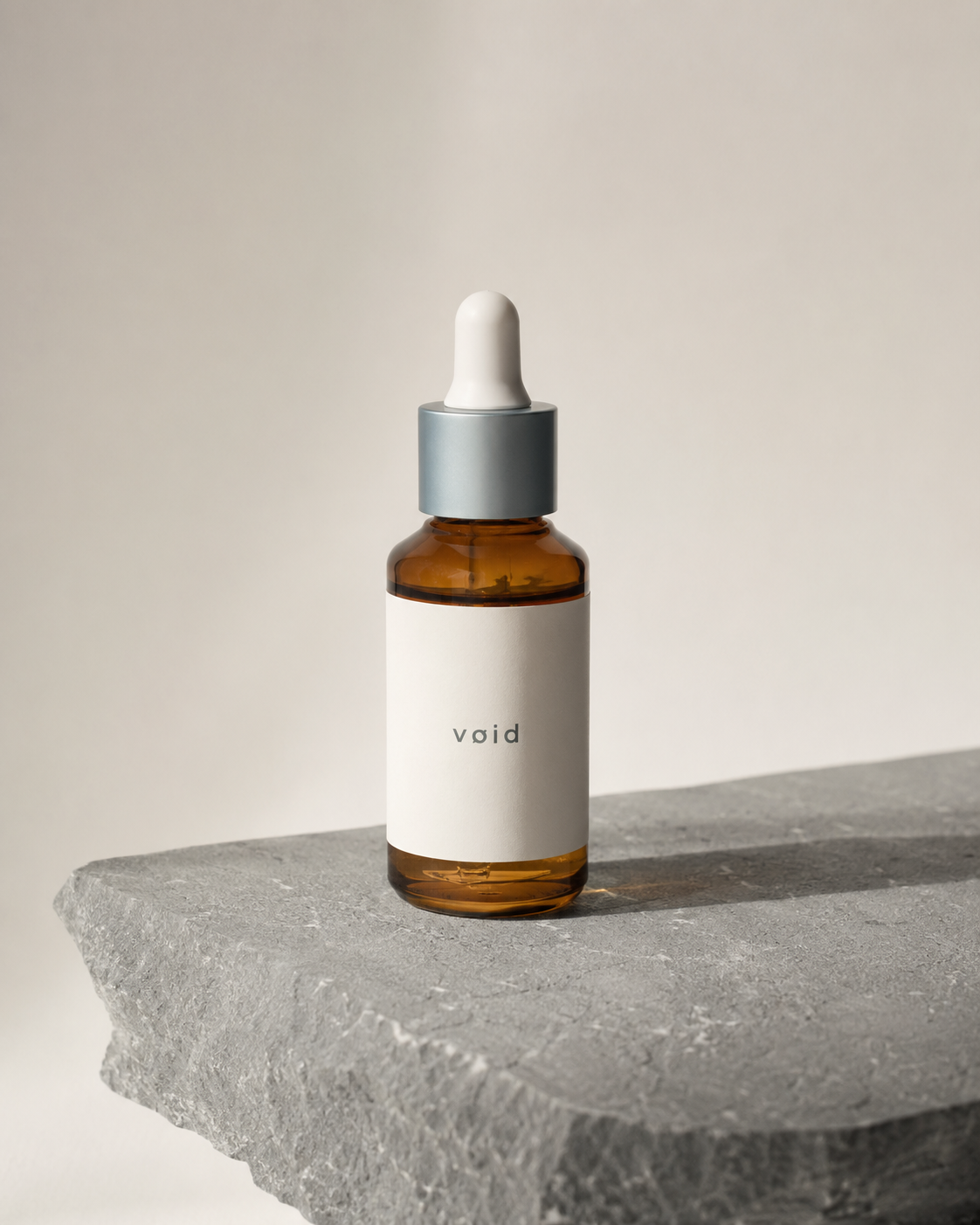 VØID Breath Oil No.1 — amber dropper bottle on raw stone
